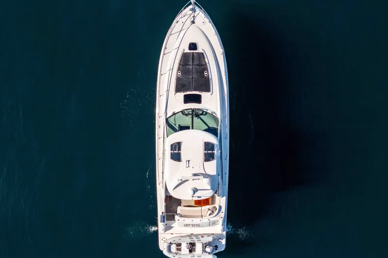 Slide: The Image of Top view of 2007 Sea Ray 48 Sundancer yacht cruising on open water. - 11