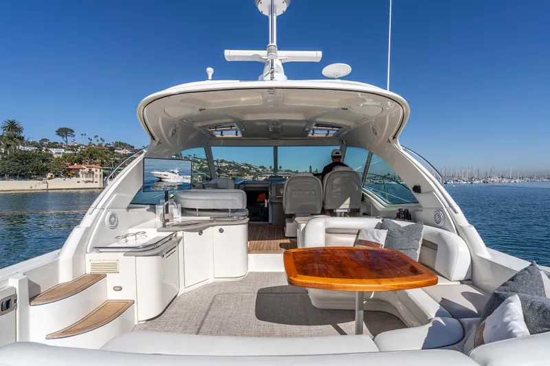 Slide: The Image of 2007 Sea Ray 48 Sundancer yacht interior with luxurious seating and scenic ocean view. - 13