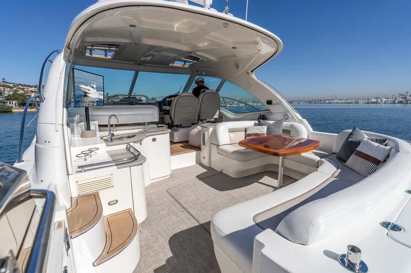 Slide: The Image of Luxurious 2007 Sea Ray 48 Sundancer yacht interior with elegant seating and scenic ocean view. - 14