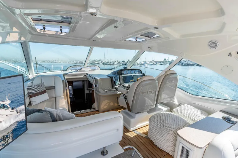 Slide: The Image of Luxurious interior of 2007 Sea Ray 48 Sundancer yacht with panoramic windows and plush seating. - 18