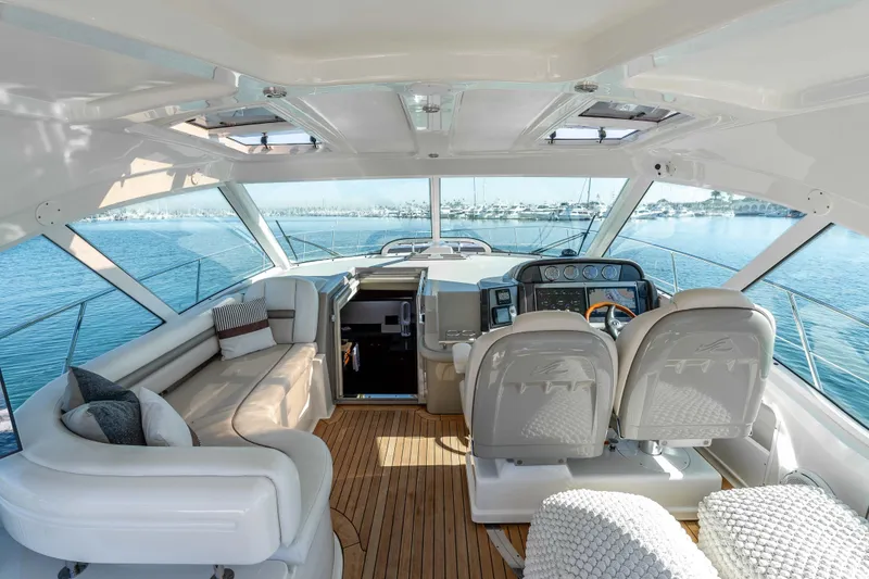 Slide: The Image of Luxurious 2007 Sea Ray 48 Sundancer yacht interior with plush seating and modern helm. - 19