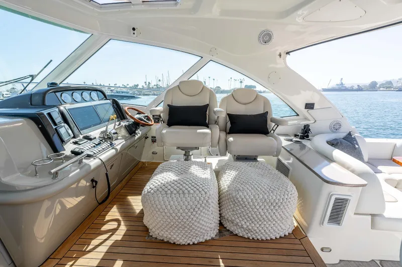 Slide: The Image of Luxurious 2007 Sea Ray 48 Sundancer yacht interior with plush seating and modern controls. - 23