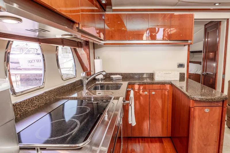 Slide: The Image of Luxurious kitchen interior of 2007 Sea Ray 48 Sundancer yacht with modern amenities. - 28