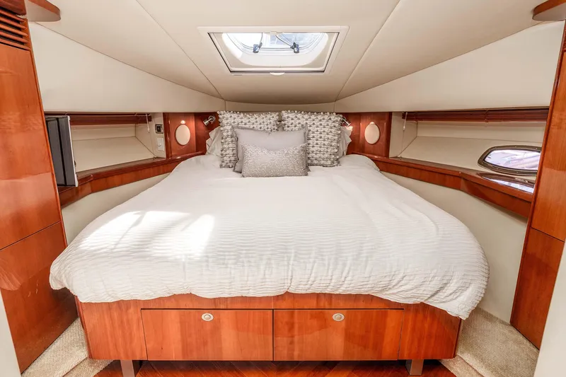 Slide: The Image of Luxurious cabin interior of 2007 Sea Ray 48 Sundancer yacht with elegant bedding. - 30