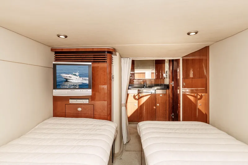 Slide: The Image of Interior of 2007 Sea Ray 48 Sundancer yacht with twin beds and TV. - 33
