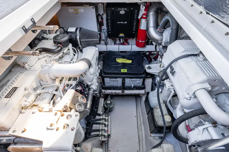 Slide: The Image of Engine room of a 2007 Sea Ray 48 Sundancer yacht, showcasing mechanical components. - 38