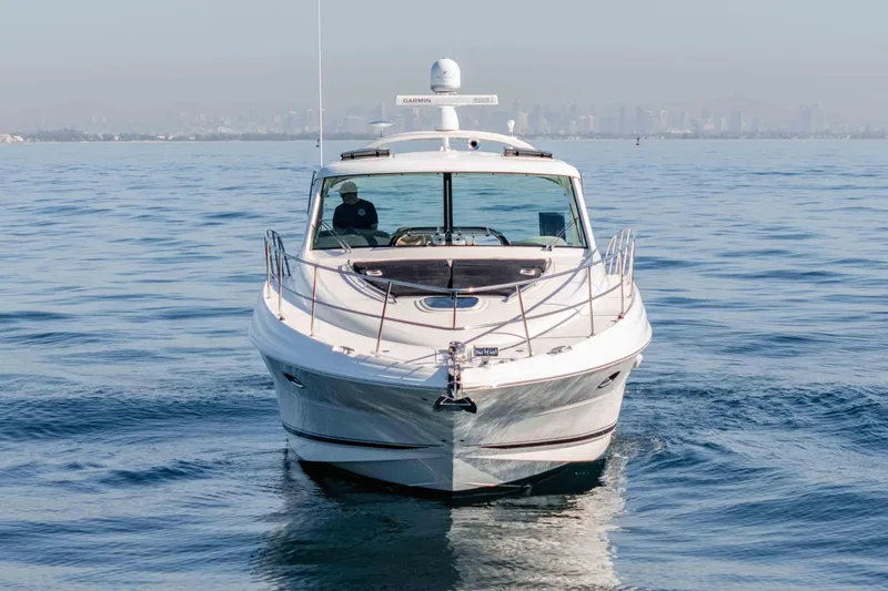 Slide: The Image of 2007 Sea Ray 48 Sundancer yacht cruising on calm ocean waters. - 6
