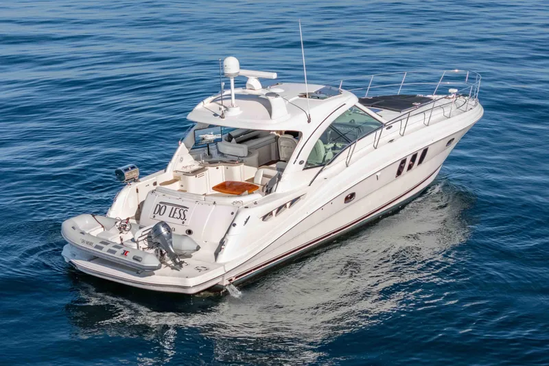 Slide: The Image of 2007 Sea Ray 48 Sundancer yacht cruising on calm blue waters. - 8