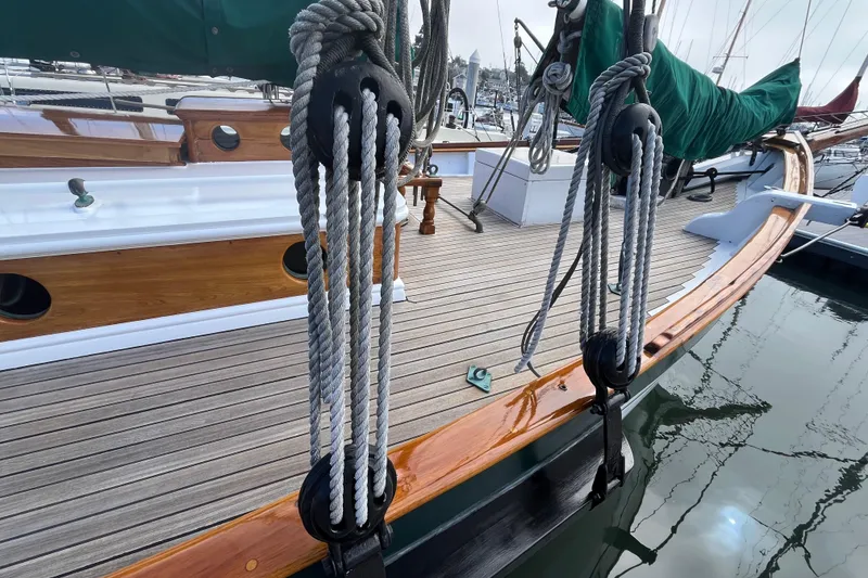 Slide: The Image of 1947 Murray Peterson Schooner deck with ropes and polished wood details. - 10