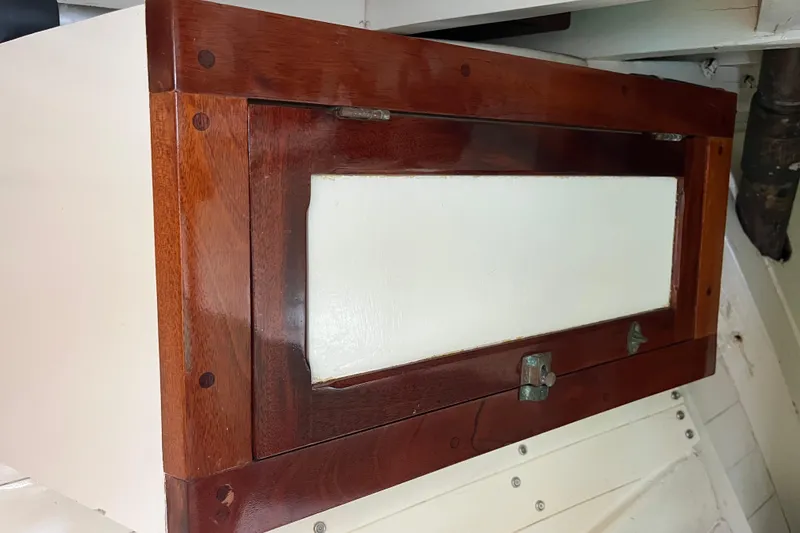 Slide: The Image of Wooden cabinet door on 1947 Murray Peterson Schooner interior. - 101