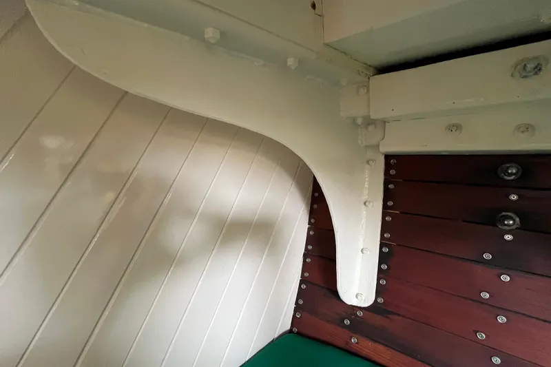 Slide: The Image of Interior detail of 1947 Murray Peterson Schooner, showcasing wooden paneling and structural elements. - 105