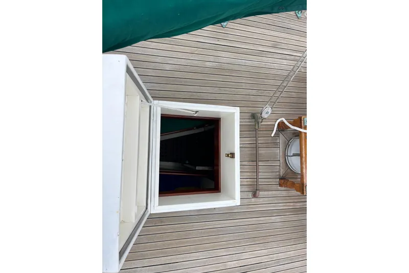 Slide: The Image of Open hatch on 1947 Murray Peterson Schooner deck, showcasing wooden craftsmanship. - 116