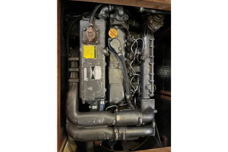 Slide: The Image of Engine of a 1947 Murray Peterson Schooner, showcasing vintage maritime machinery. - 122