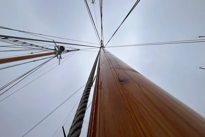 Slide: The Image of Looking up at the mast of a 1947 Murray Peterson Schooner against a cloudy sky. - 138