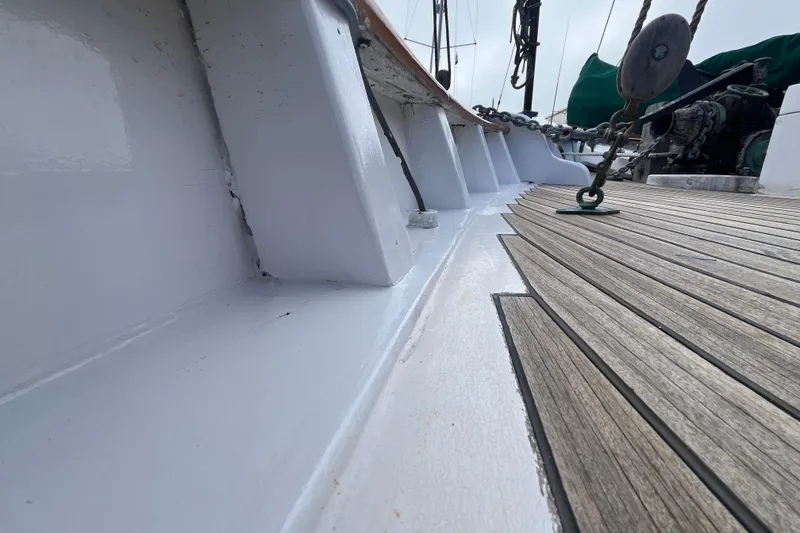 Slide: The Image of Wooden deck of a 1947 Murray Peterson Schooner, showcasing detailed craftsmanship. - 17