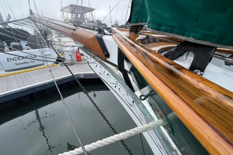 Slide: The Image of 1947 Murray Peterson Schooner docked in Sausalito, CA, showcasing polished wooden details. - 22