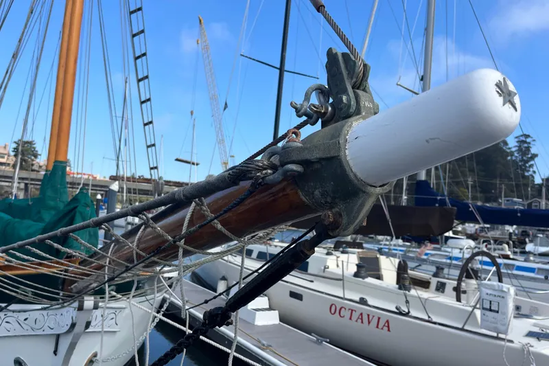 Slide: The Image of Close-up of a 1947 Murray Peterson Schooner's rigging in a marina setting. - 3
