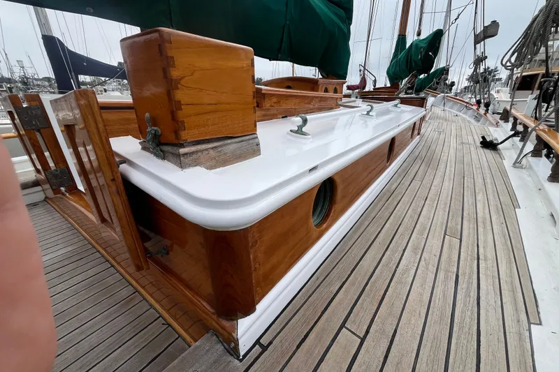 Slide: The Image of 1947 Murray Peterson Schooner with polished wood and sleek deck design. - 34