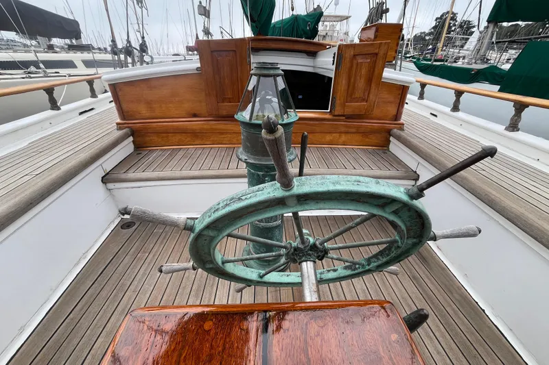 Slide: The Image of 1947 Murray Peterson Schooner helm with wooden deck and classic design elements. - 38