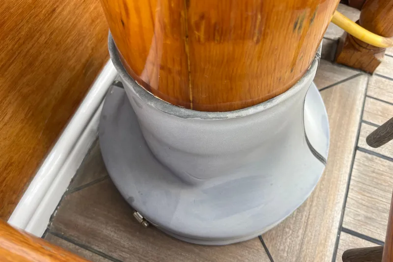 Slide: The Image of Wooden mast base on 1947 Murray Peterson Schooner deck, featuring polished wood and metal fittings. - 42
