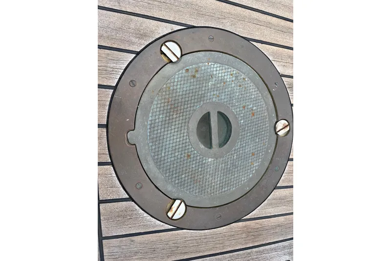 Slide: The Image of Round metal hatch on 1947 Murray Peterson Schooner deck. - 46