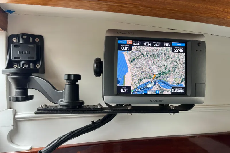 Slide: The Image of Garmin GPS device on 1947 Murray Peterson Schooner, displaying nautical navigation map. - 65