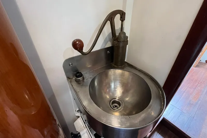 Slide: The Image of Vintage metal sink with hand pump on 1947 Murray Peterson Schooner. - 67