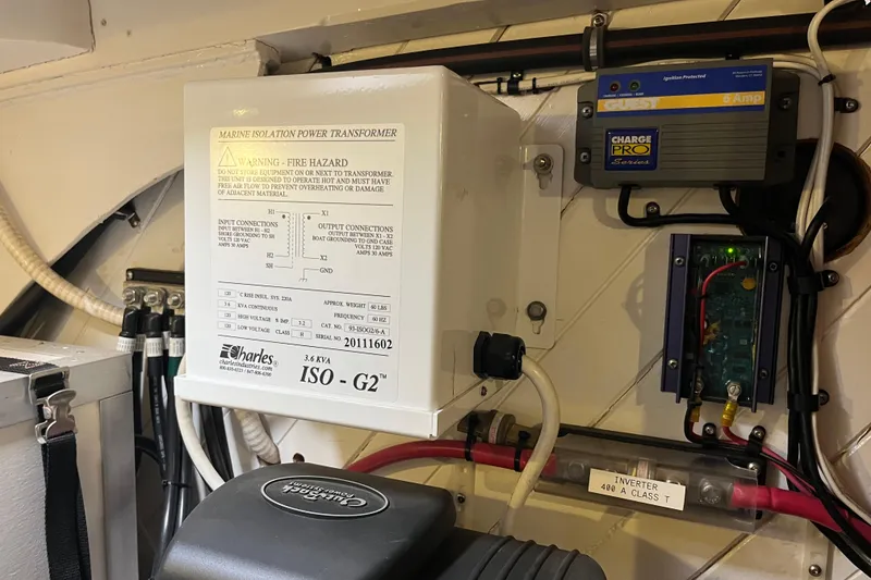 Slide: The Image of Electrical components in a 1947 Murray Peterson Schooner, featuring a marine isolation power transformer. - 75
