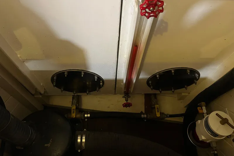 Slide: The Image of Engine room of 1947 Murray Peterson Schooner with valves and pipes. - 76