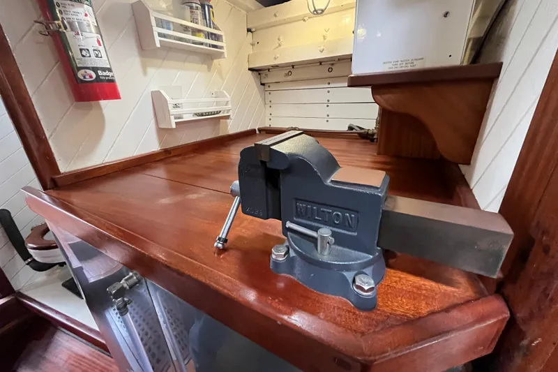 Slide: The Image of Wooden workbench with a Wilton vise on a 1947 Murray Peterson Schooner. - 77