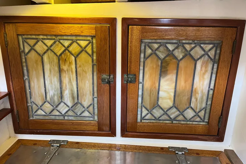 Slide: The Image of Stained glass cabinet doors on a 1947 Murray Peterson Schooner. - 81