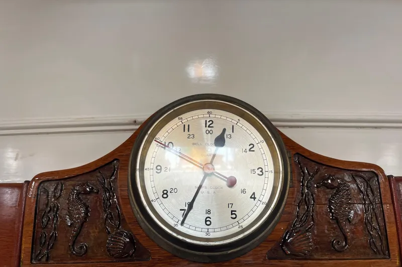 Slide: The Image of Vintage clock on 1947 Murray Peterson Schooner with carved seahorse details. - 93