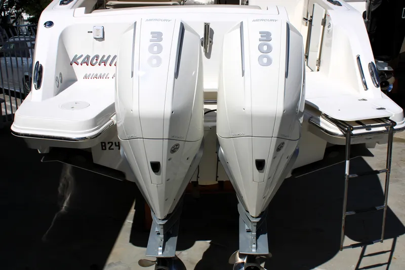 Slide: The Image of 2021 Boston Whaler 320 Vantage with twin Mercury 300 engines, docked in Miami. - 11