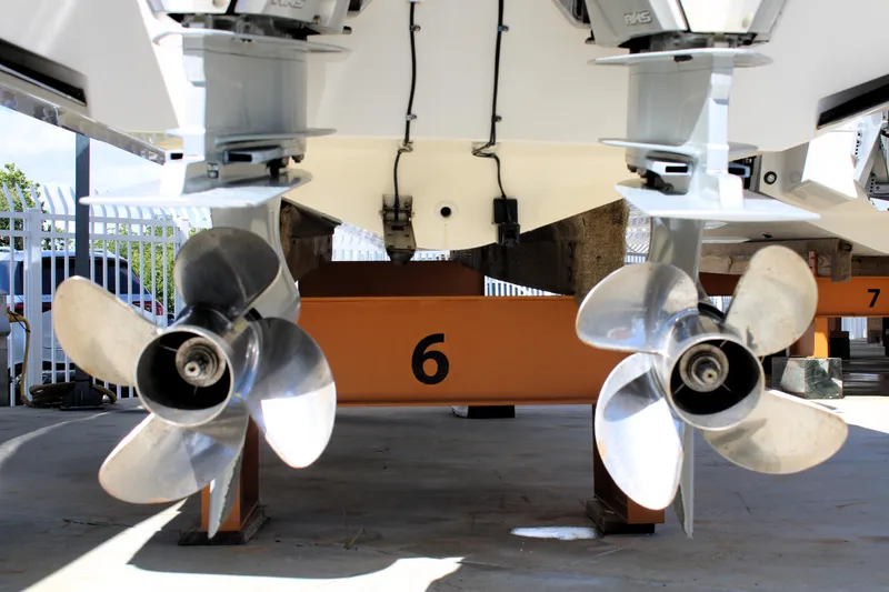 Slide: The Image of Boston Whaler 320 Vantage 2021 boat propellers on display in a storage facility. - 12