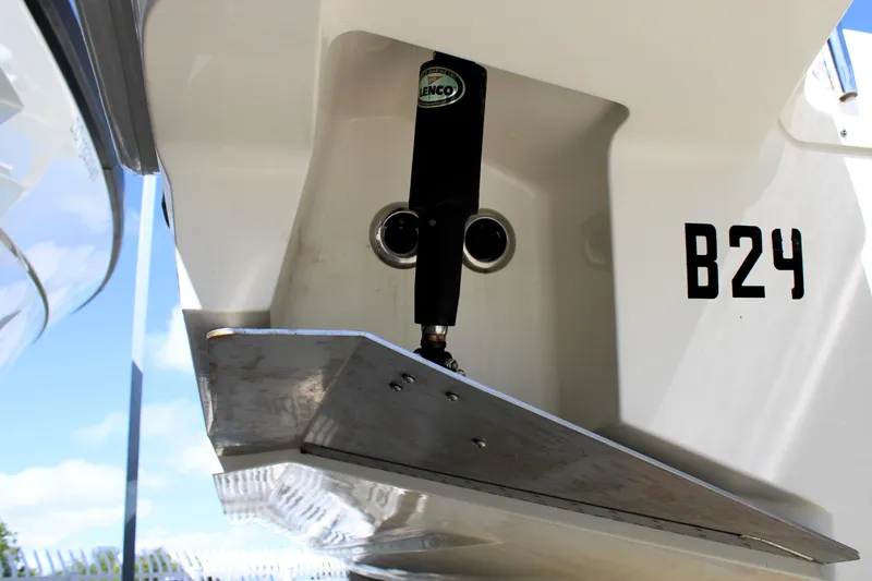 Slide: The Image of 2021 Boston Whaler 320 Vantage boat detail with trim tab and B24 marking. - 14