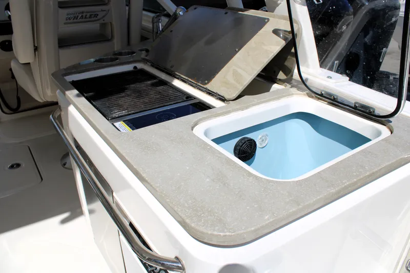 Slide: The Image of 2021 Boston Whaler 320 Vantage boat interior with sink and grill station. - 25