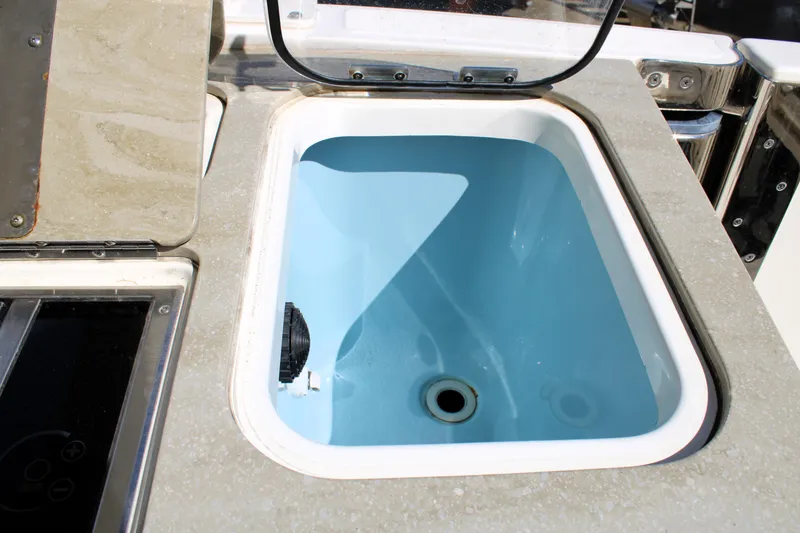 Slide: The Image of Livewell on 2021 Boston Whaler 320 Vantage boat, featuring a sleek design. - 26