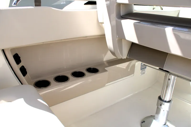 Slide: The Image of Interior of 2021 Boston Whaler 320 Vantage boat with cup holders and seating. - 32