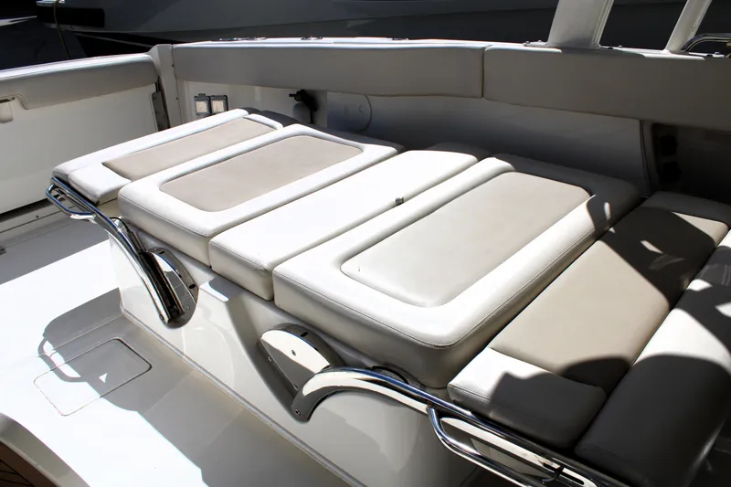 Slide: The Image of 2021 Boston Whaler 320 Vantage boat interior seating with cushioned lounge area. - 36