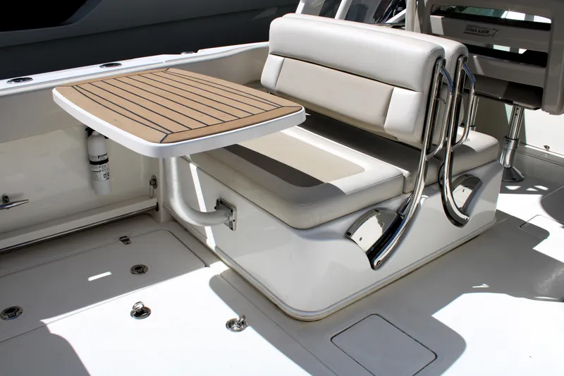 Slide: The Image of 2021 Boston Whaler 320 Vantage interior with seating and table. - 38