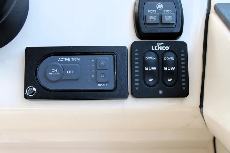 Slide: The Image of Control panel of a 2021 Boston Whaler 320 Vantage boat with trim and bow controls. - 48