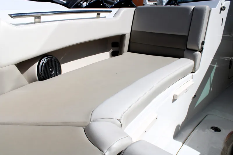 Slide: The Image of 2021 Boston Whaler 320 Vantage interior seating with speaker, showcasing luxury and comfort. - 61