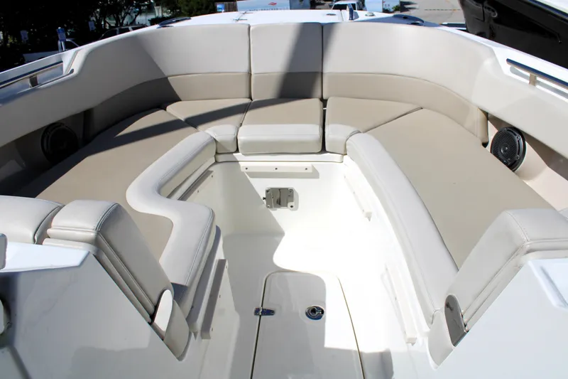 Slide: The Image of 2021 Boston Whaler 320 Vantage boat interior with beige seating and speakers. - 62