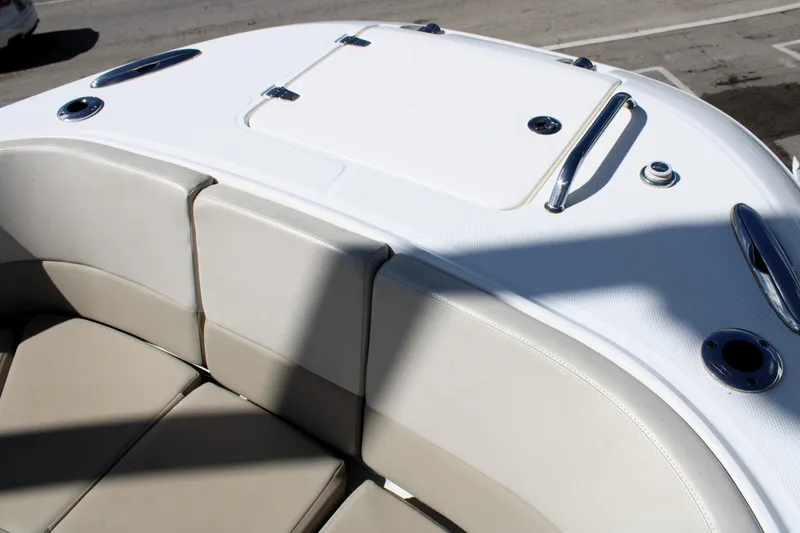 Slide: The Image of 2021 Boston Whaler 320 Vantage boat seating area with storage compartment. - 67