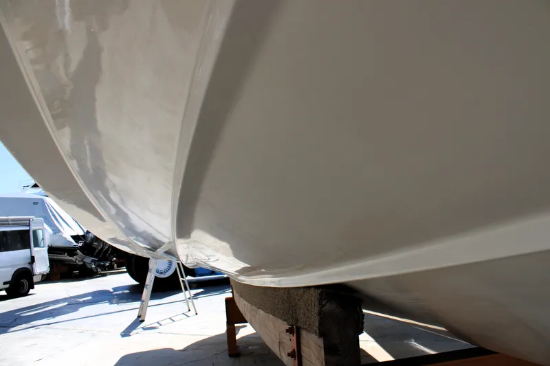 Slide: The Image of Close-up of 2021 Boston Whaler 320 Vantage boat hull on a stand. - 7