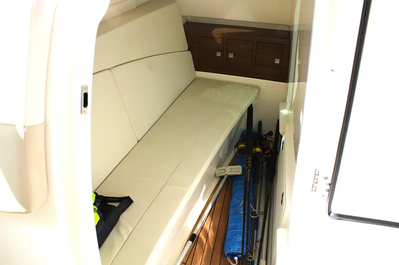 Slide: The Image of Interior of 2021 Boston Whaler 320 Vantage with seating and fishing gear storage. - 71