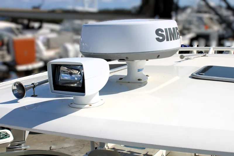 Slide: The Image of Radar and spotlight on 2021 Boston Whaler 320 Vantage boat deck. - 84