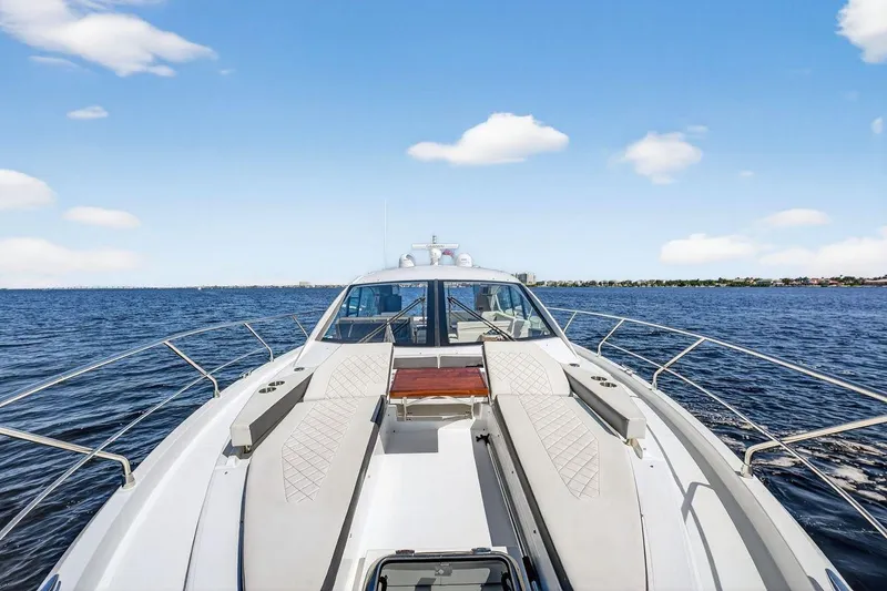 Slide: The Image of 2020 Cruisers Yachts 50 Cantius on open water under blue sky. - 18