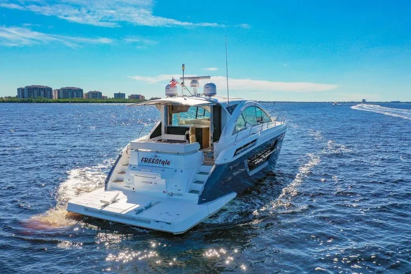 Slide: The Image of 2020 Cruisers Yachts 50 Cantius sailing on a sunny day with city skyline in background. - 3
