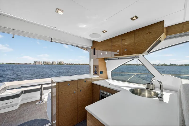 Slide: The Image of Interior of 2020 Cruisers Yachts 50 Cantius with modern kitchen and ocean view. - 34